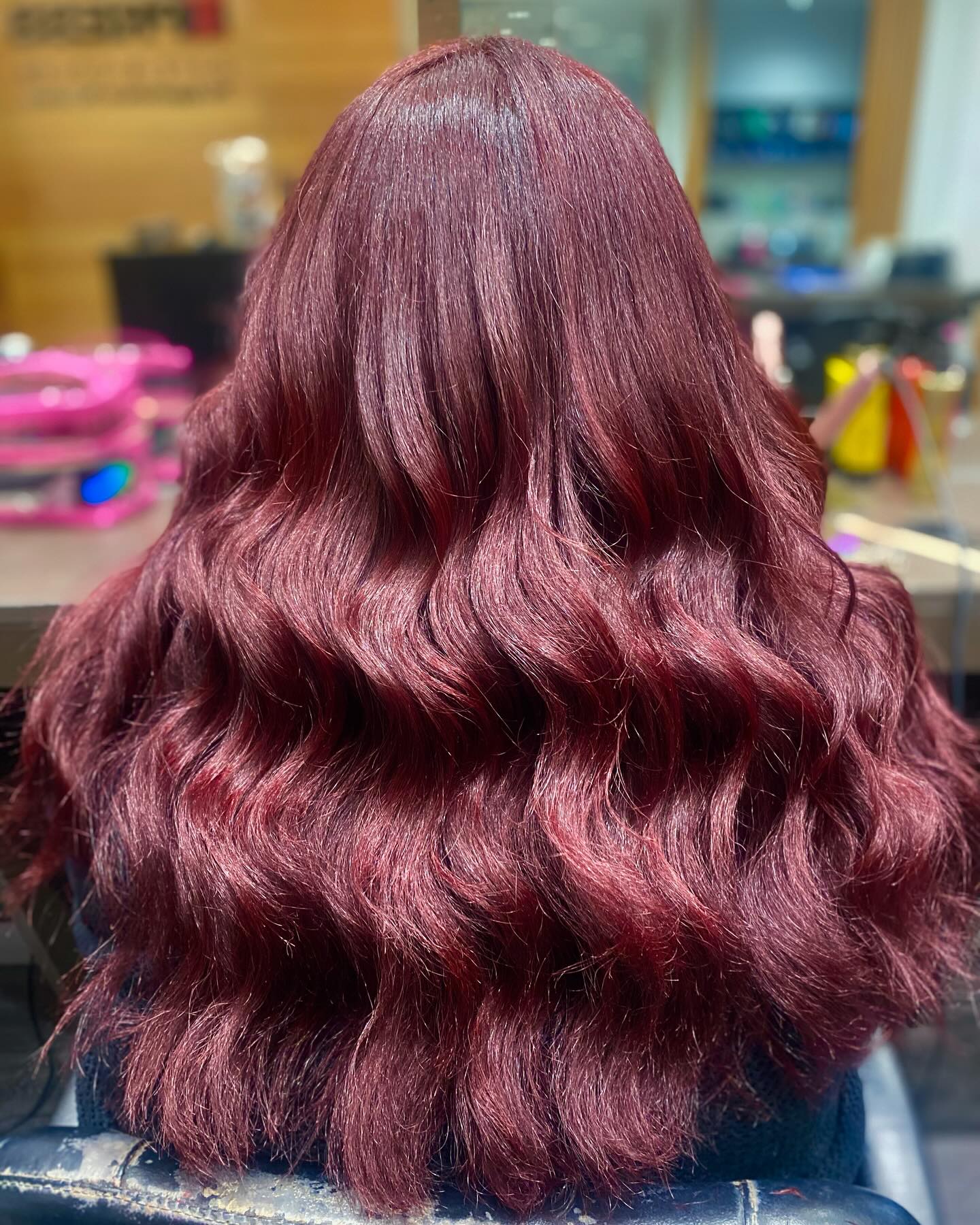 Burgundy red curls with high shine